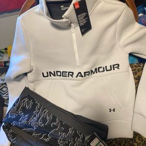 Brand New with tags woman’s Under Armor sweater and leggings.